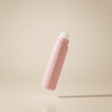 Kie Skin Body Adhesive roll-on bottle uncapped, angled to show the clear applicator ball